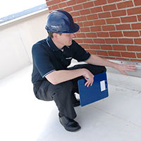 roofer inspecting a seam