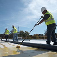 crew installing a new TPO roof