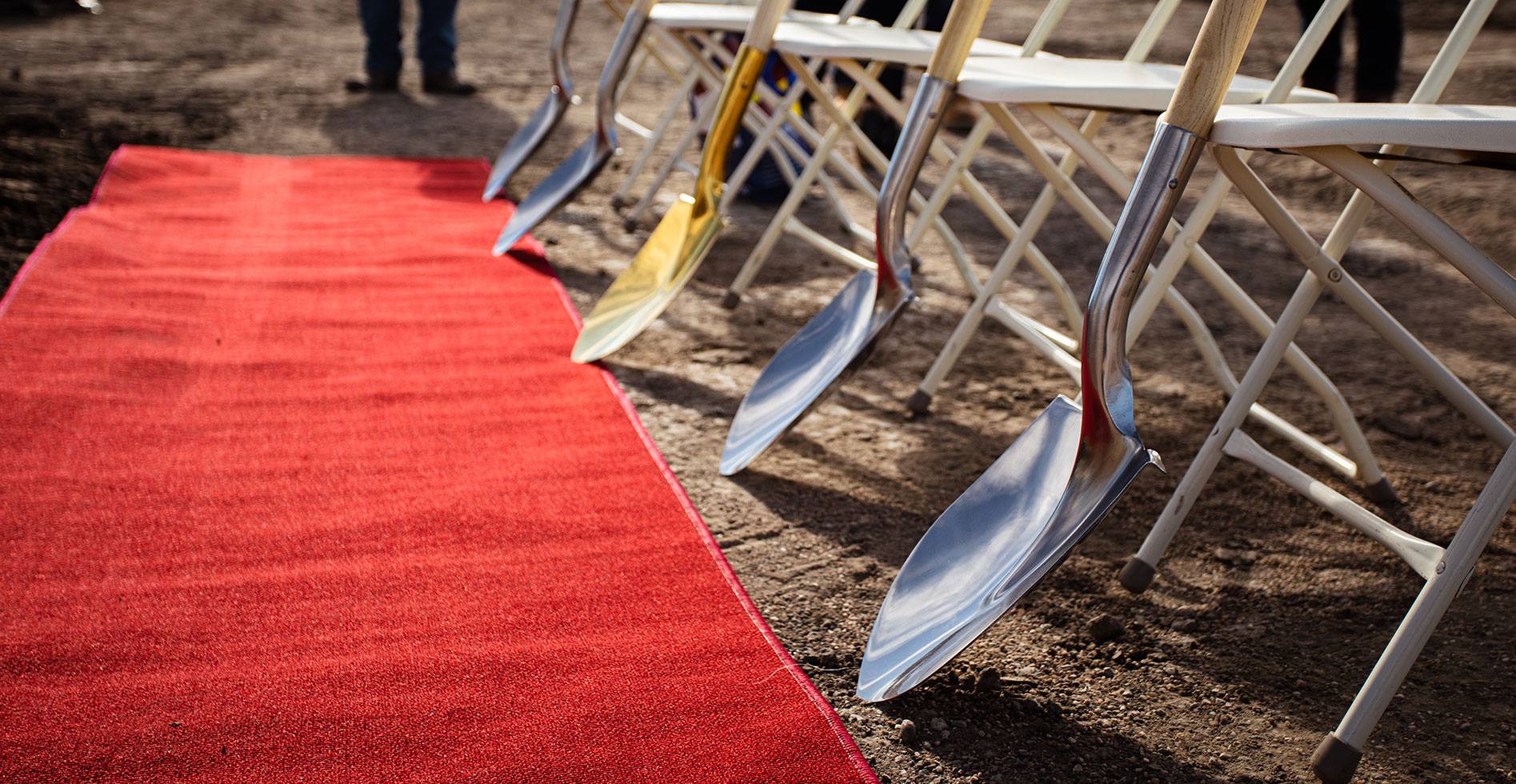 shovels line up to break ground for new construction