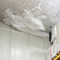 ice build up on a ceiling of a cold storage facility - indication of roof issue