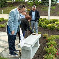 Dunlap family receiving memorial bench for Edward Dunlap Jr