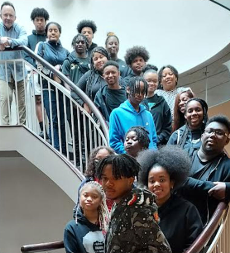 Neighborhood Academy kids posing on CentiMarks stairs