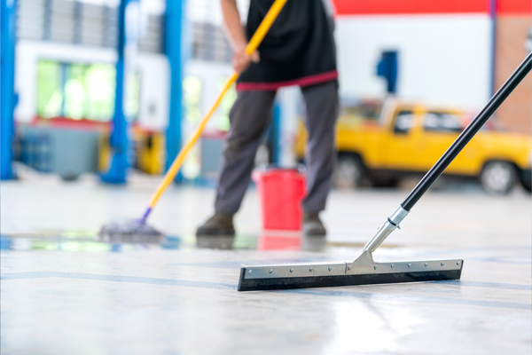 cleaning floors in a garage