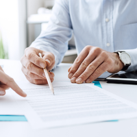 business people looking over documentation and warranties