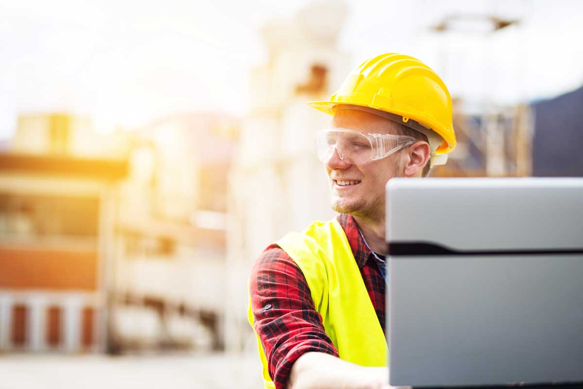 construction worker on a  laptop